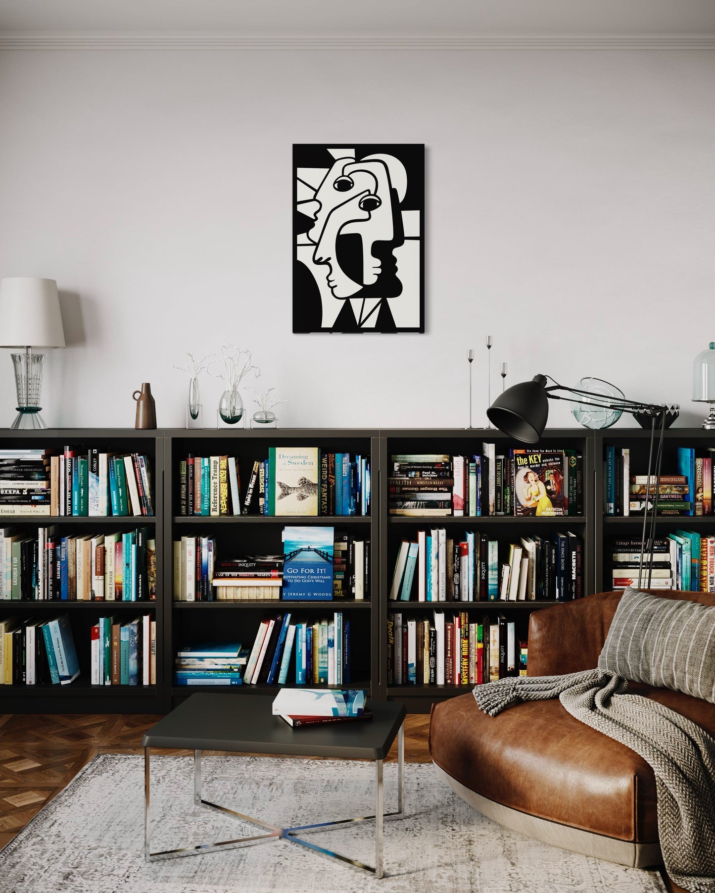 Cubist faces wooden wall decoration hanging above a console filled with books