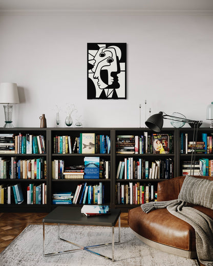 Cubist faces wooden wall decoration hanging above a console filled with books